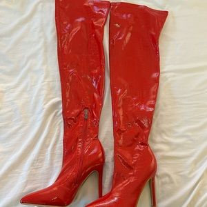 Thigh-high snake skin boot